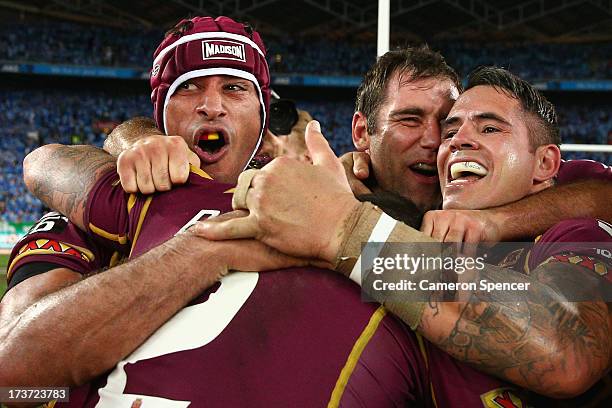 Johnathan Thurston, Cameron Smith and Corey Parker of the Maroons celebrate winning game three of the ARL State of Origin series between the New...