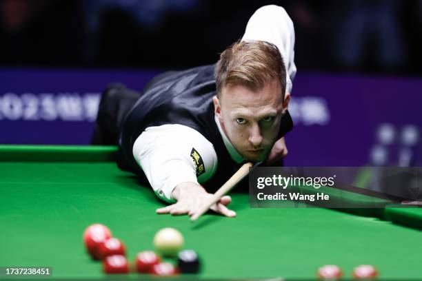 Judd Trump of England plays a shot in the final match against Ali Carter of England on Day 7 of World Snooker Wuhan open 2023 at Wuhan Stadium on...