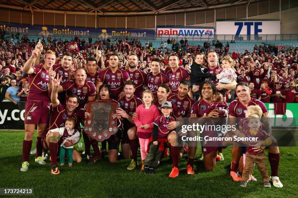 The Maroons pose with their children after winning game three of the ARL State of Origin series between the New South Wales Blues and the Queensland...