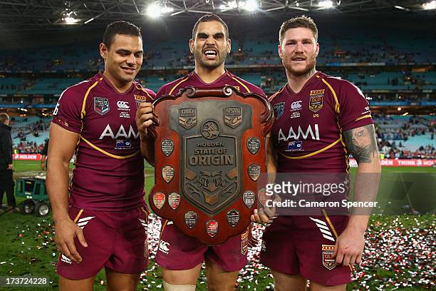 Ben Teo, Greg Inglis and Chris McQueen of the Maroons pose with the trophy after winning game three of the ARL State of Origin series between the New...