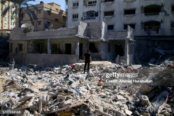 Palestinian citizens inspect damage to their homes caused by Israeli airstrikes on October 15, 2023 in Khan Younis, Gaza. Many Gazan citizens have...