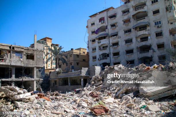 Palestinian citizens inspect damage to their homes caused by Israeli airstrikes on October 15, 2023 in Khan Younis, Gaza. Many Gazan citizens have...