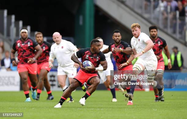 Josua Tuisova of Fiji runs with the ball during the Rugby World Cup France 2023 Quarter Final match between England and Fiji at Stade Velodrome on...