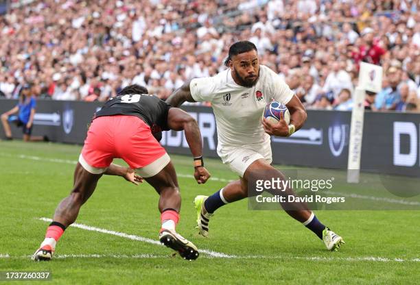 Manu Tuilagi of England breaks through to the try line to score his team's first try during the Rugby World Cup France 2023 Quarter Final match...