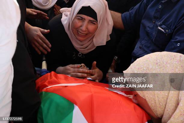 Relatives mourn over the body of 17-year-old Oday Mansour, a day after he was killed during clashes with Israeli soldiers at a military checkpoint...