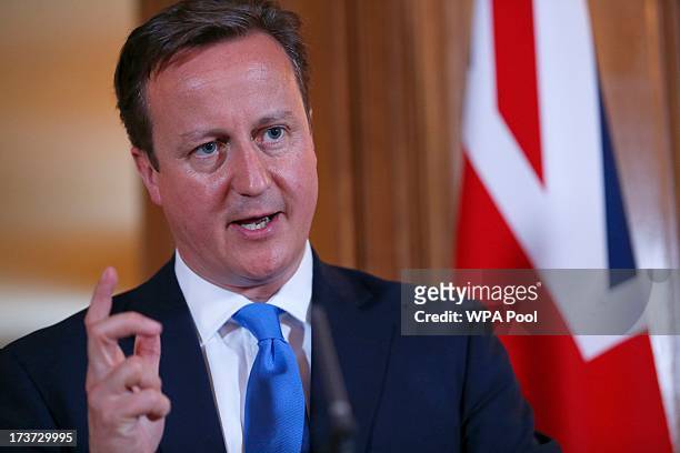 Britain's Prime Minister David Cameron answers a question during a joint news conference with Italy's Prime Minister Enrico Letta in 10 Downing...
