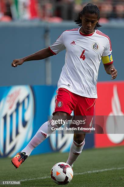 Joel Huiqui of Mexico in action against Martinique during the first half of a CONCACAF Gold Cup match at Sports Authority Field at Mile High on July...