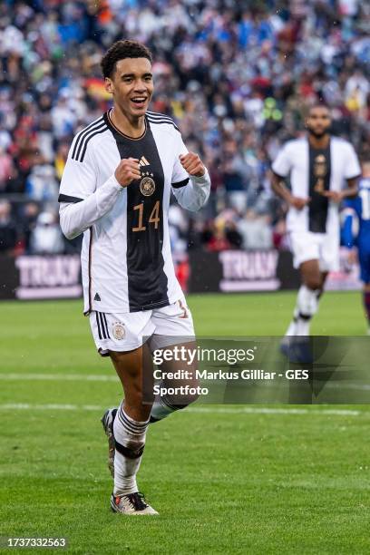 Jamal Musiala of Germany celebrates after scoring his team's third goal during the international friendly match between Germany and United States at...