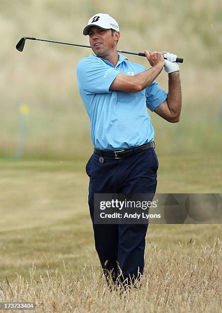 Matt Kuchar of the United States hits a shot ahead of the 142nd Open Championship at Muirfield on July 17, 2013 in Gullane, Scotland.