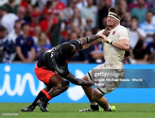 Tom Curry of England clashes with Levani Botia of Fiji during the Rugby World Cup France 2023 Quarter Final match between England and Fiji at Stade...