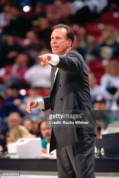 Head Coach Doug Collins of the Detroit Pistons signals to his players during a game against the Sacramento Kings played on February 26, 1996 at Arco...