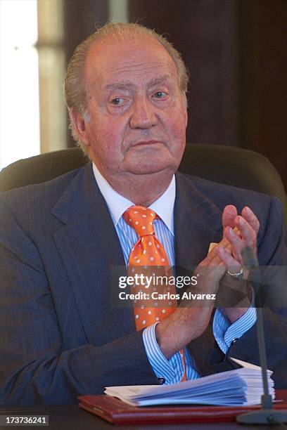 King Juan Carlos of Spain attends a meeting of heads of universities of Spain and Morocco at the "Palacio Real de Huespedes" during the third day of...