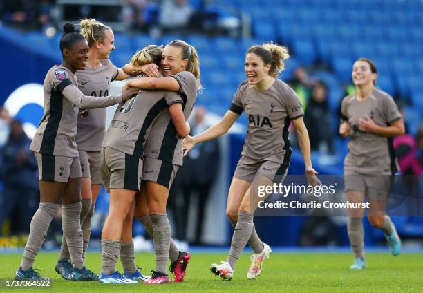 Grace Clinton of Tottenham Hotspur celebrates with teammates after scoring the team's second goal during the Barclays Women's Super League match...