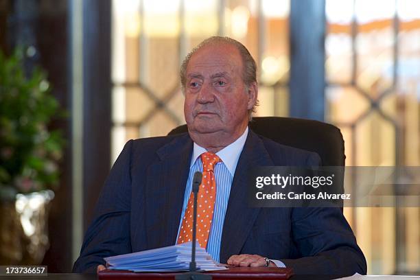 King Juan Carlos of Spain attends a meeting of heads of universities of Spain and Morocco at the "Palacio Real de Huespedes" during the third day of...