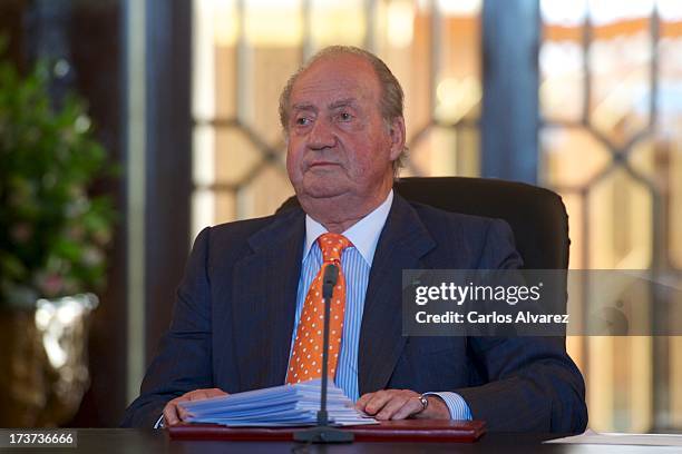 King Juan Carlos of Spain attends a meeting of heads of universities of Spain and Morocco at the "Palacio Real de Huespedes" during the third day of...