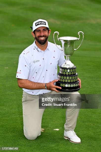 Matthieu Pavon of France is presented with the trophy after winning on Day Four of the acciona Open de Espana presented by Madrid at Club de Campo...