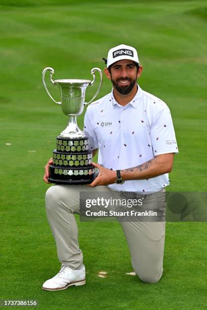 Matthieu Pavon of France is presented with the trophy after winning on Day Four of the acciona Open de Espana presented by Madrid at Club de Campo...