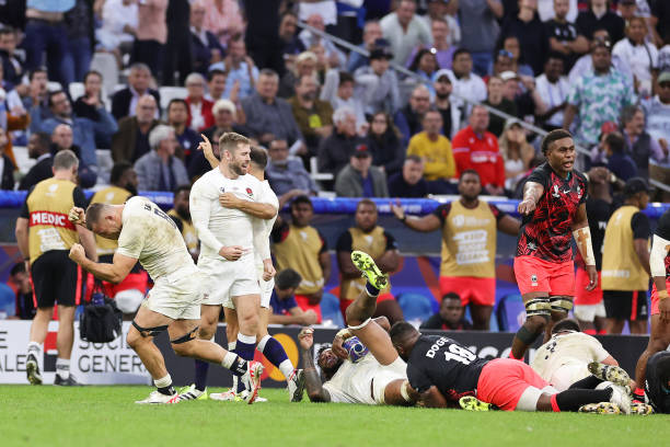 The players of England celebrate victory at full-time following the Rugby World Cup France 2023 Quarter Final match between England and Fiji at Stade...