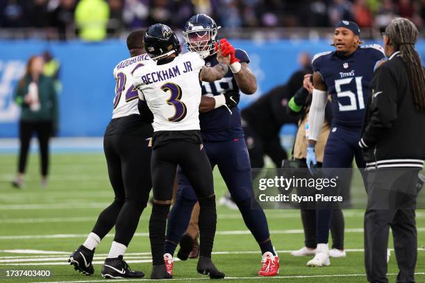 Jeffery Simmons of the Tennessee Titans clashes with Odell Beckham Jr. #3 of the Baltimore Ravens after the 2023 NFL London Games match between...