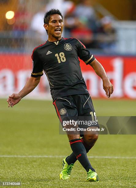 Juan Carlos Valenzuela of Mexico follows the play against Canada at CenturyLink Field on July 11, 2013 in Seattle, Washington.