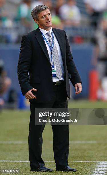 Interim head coach Colin Miller of Canada looks on during the match against Mexico at CenturyLink Field on July 11, 2013 in Seattle, Washington.