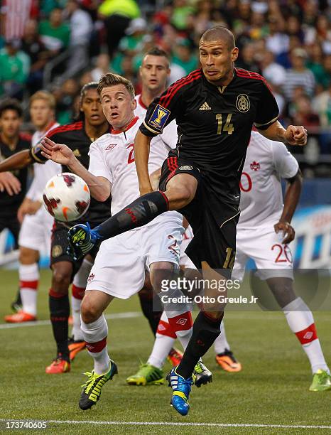 Jorge Enriquez of Mexico controls the ball against Canada at CenturyLink Field on July 11, 2013 in Seattle, Washington.