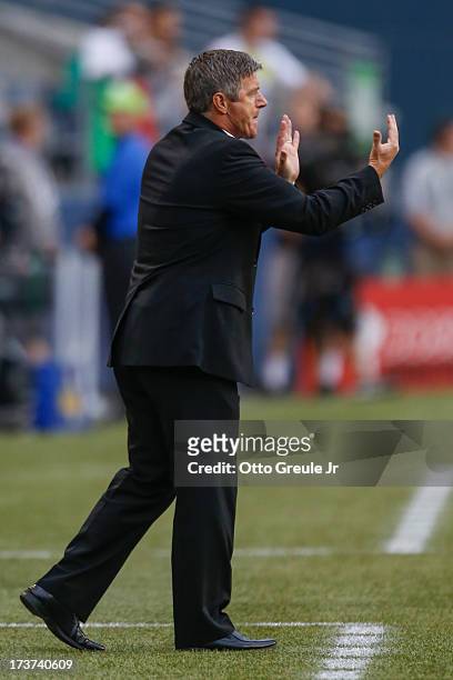 Interim head coach Colin Miller of Canada gestures during the match against Mexico at CenturyLink Field on July 11, 2013 in Seattle, Washington.