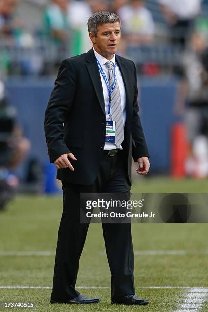 Interim head coach Colin Miller of Canada looks on during the match against Mexico at CenturyLink Field on July 11, 2013 in Seattle, Washington.