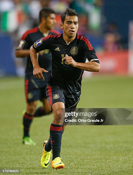 Adrian Aldrete of Mexico follows the play against Canada at CenturyLink Field on July 11, 2013 in Seattle, Washington.