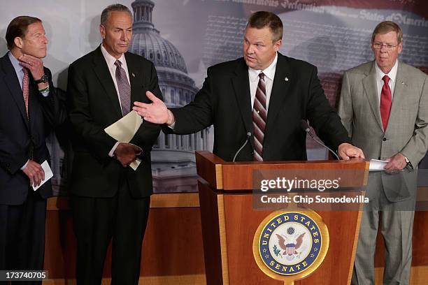 Sen. Jon Tester speaks during a news conference about media shield legislation co-sponsored by U.S. Sen. Richard Blumenthal , U.S. Sen. Charles...