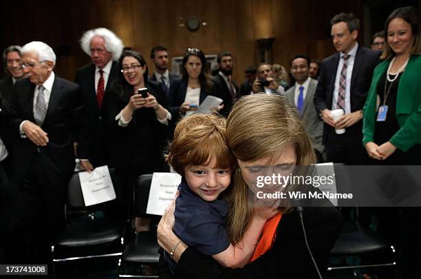 Declan Power Sunstein hugs his mother, Samantha Power, the nominee to be the U.S. Representative to the United Nations, at the conclusion of her...