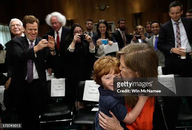Declan Power Sunstein hugs his mother, Samantha Power, the nominee to be the U.S. Representative to the United Nations, at the conclusion of her...