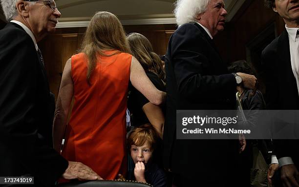 Declan Power Sunstein waits for his mother, Samantha Power, the nominee to be the U.S. Representative to the United Nations, as she greets friends...