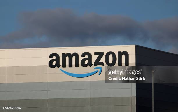 The Amazon logo is displayed outside Amazon UK MAN8 Warehouse on October 15, 2023 in Haydock, United Kingdom.