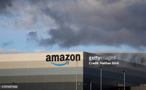 The Amazon logo is displayed outside Amazon UK MAN8 Warehouse on October 15, 2023 in Haydock, United Kingdom.