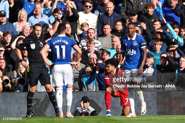 Ashley Young of Everton receives a red card during the Premier League match between Liverpool FC and Everton FC at Anfield on October 21, 2023 in...