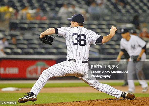 Preston Claiborne of the New York Yankees pitches against the Minnesota Twins at Yankee Stadium on July 12, 2013 in the Bronx borough of New York...