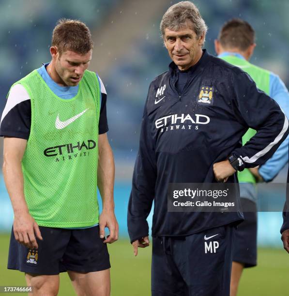 James Milner of Manchester City with Manuel Pellegrini Manger of Manchester City during the Manchester City training session at Moses Mabhida Stadium...