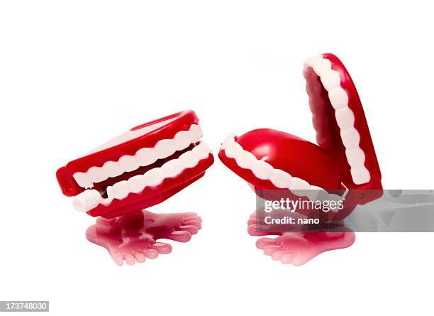 two abstract red mouths with feet causing the other to laugh - mouth talking stock pictures, royalty-free photos & images