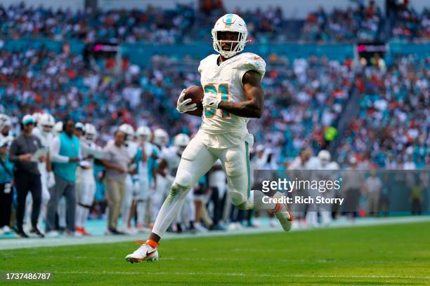 Raheem Mostert of the Miami Dolphins scores a touchdown during the second quarter in the game against the Carolina Panthers at Hard Rock Stadium on...