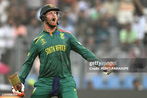 South Africa's Heinrich Klaasen celebrates after scoring a century during the 2023 ICC Men's Cricket World Cup one-day international match between...