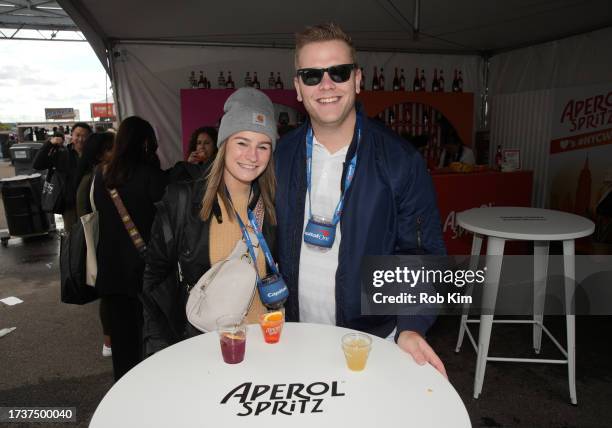 Guests visit Aperol Spritz booth the Food Network New York City Wine & Food Festival presented by Capital One - Grand Tasting featuring Culinary...