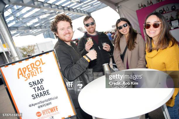 Guests visit Aperol Spritz booth the Food Network New York City Wine & Food Festival presented by Capital One - Grand Tasting featuring Culinary...