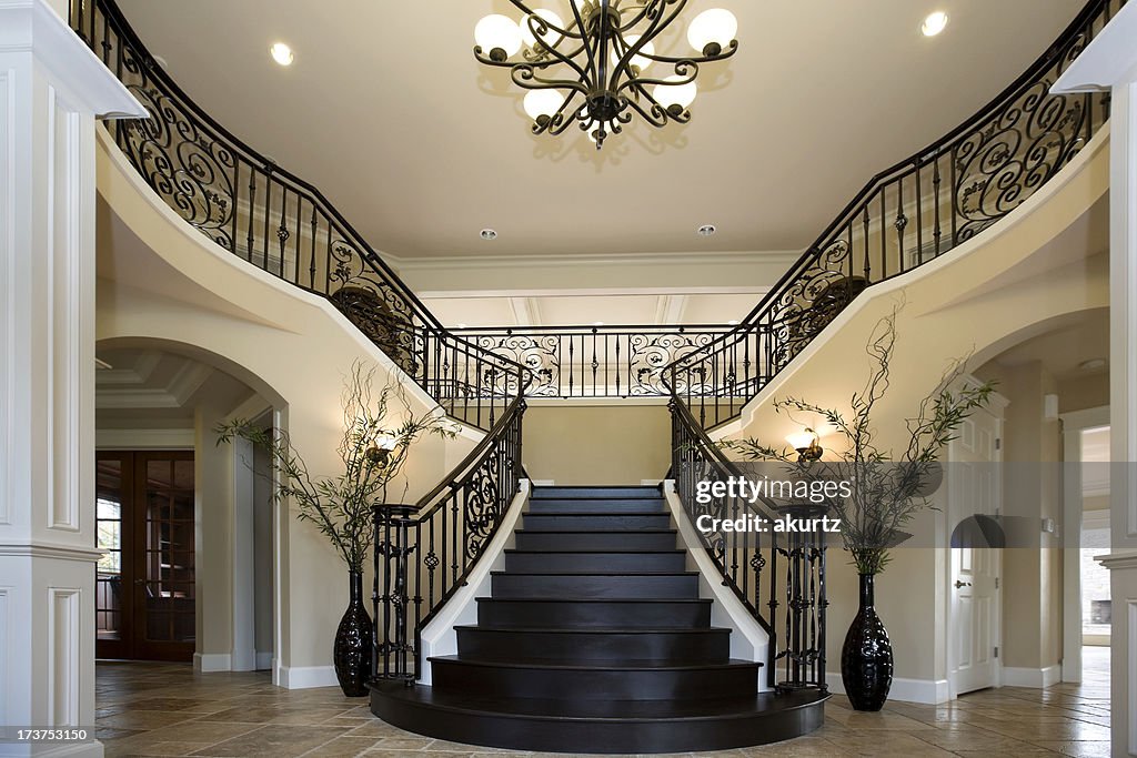 Grand Entryway With Dual Iron Staircase Interior Architecture Design ...