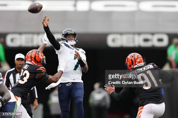 Geno Smith of the Seattle Seahawks has his pass deflected by Dax Hill of the Cincinnati Bengals during the second quarter at Paycor Stadium on...