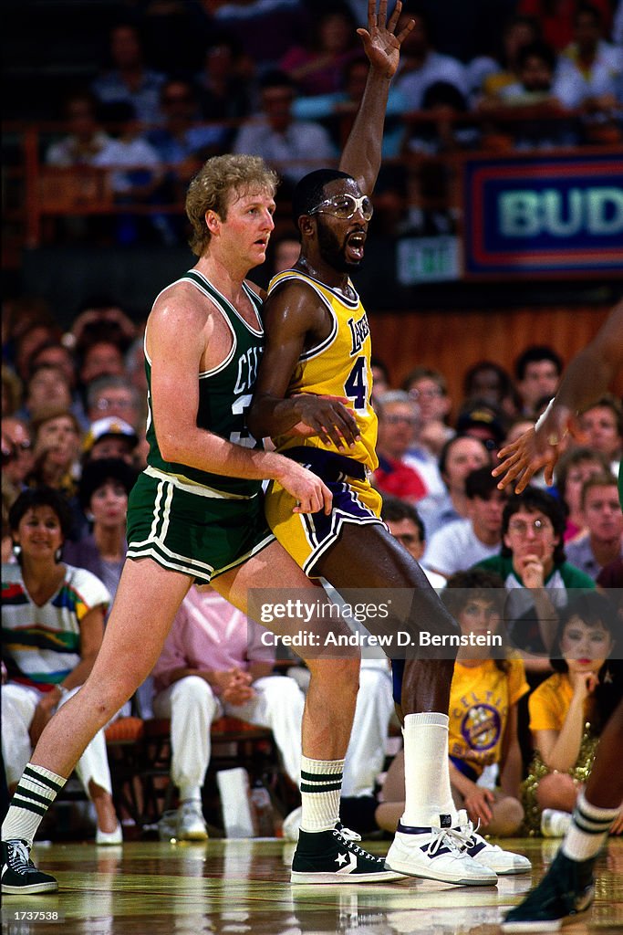 James Worthy of the Los Angeles Lakers posts up against Larry Bird of ...