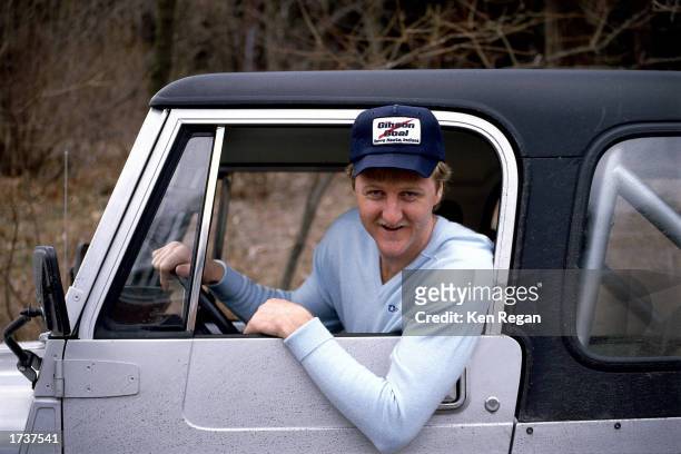 Larry Bird of the Boston Celtics poses for a photo in his truck. NOTE TO USER: User expressly acknowledges and agrees that, by downloading and/or...