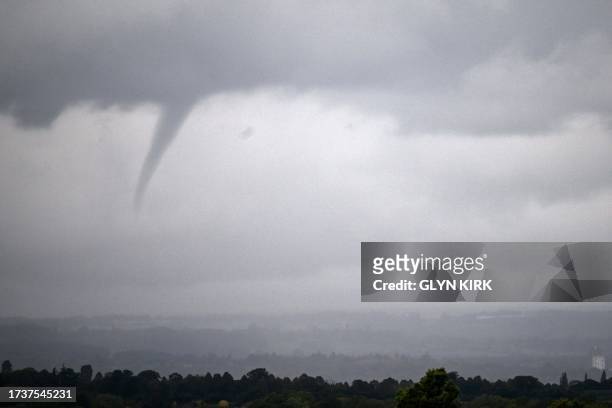 Funnel cloud is seen north of the racecourse on Qipco British Champions Day at Ascot Racecourse, west of London on October 21, 2023. Champions day is...