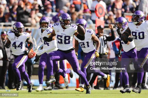 Jordan Hicks of the Minnesota Vikings celebrates an interception during the first half in the game against the Chicago Bears at Soldier Field on...