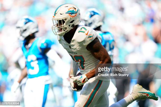 Jaylen Waddle of the Miami Dolphins celebrates a touchdown during the first half in the game against the Carolina Panthers at Hard Rock Stadium on...